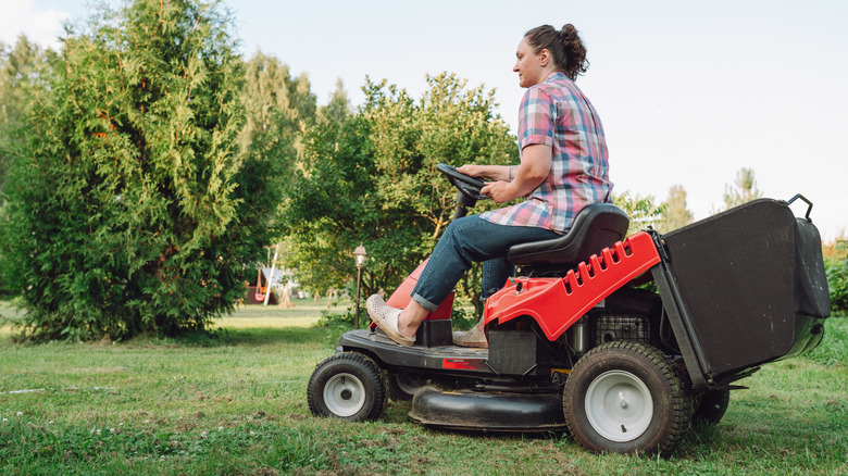 Woman on a riding lawn mower