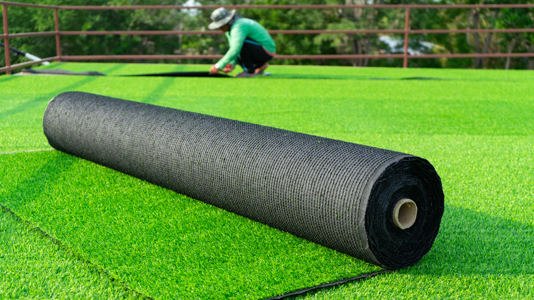 person laying turf