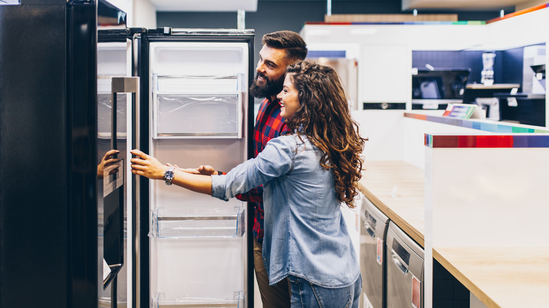 Couple buying a fridge