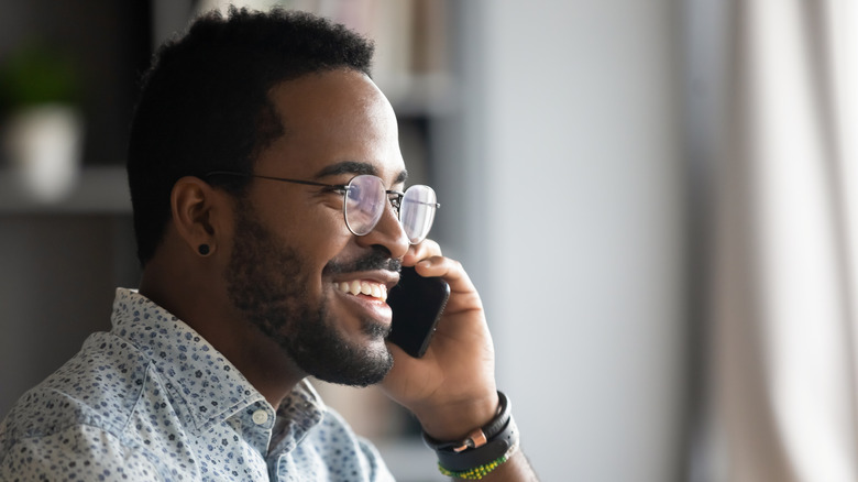 Young man talking on phone