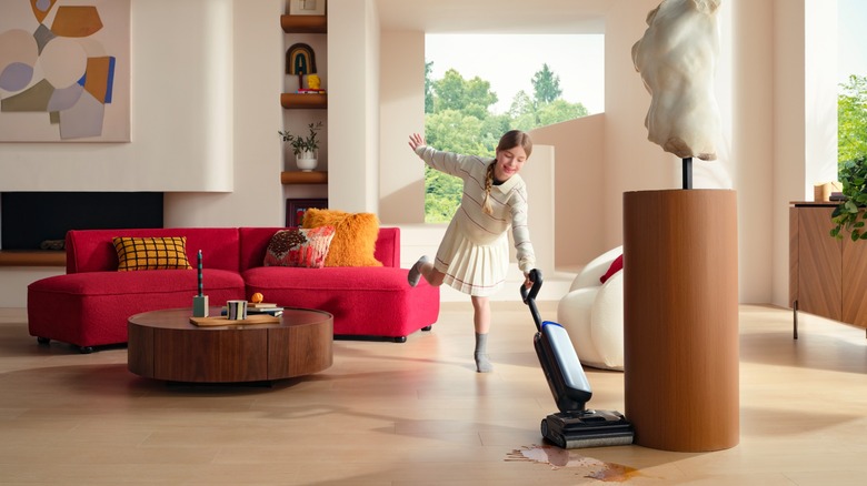 Girl dancing and cleaning up spill with Tineco S9 Artist PRO