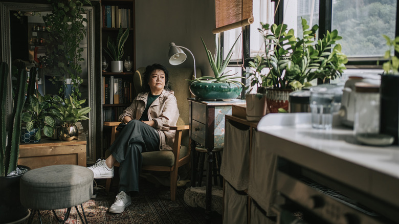 person sitting in decorated corner of home