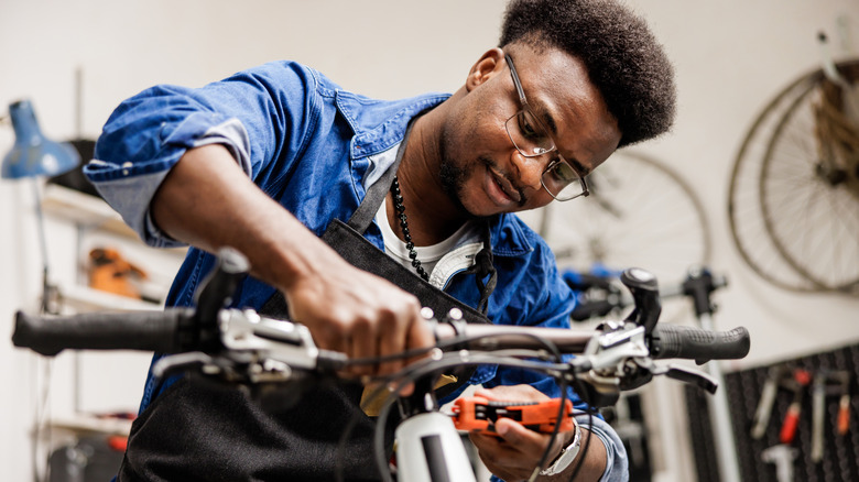 Man repairing his bicycle