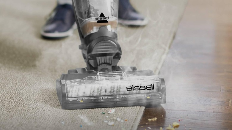 Bissell vacuum vacuuming on both carpet and hard flooring.