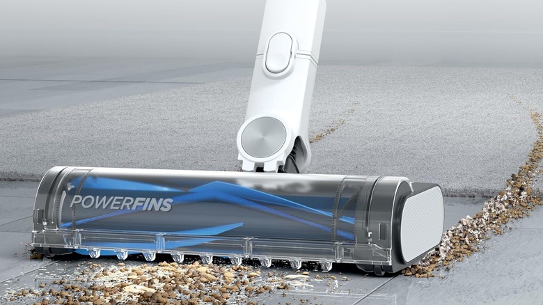 A close up of the Shark's head removing large debris from the floor.