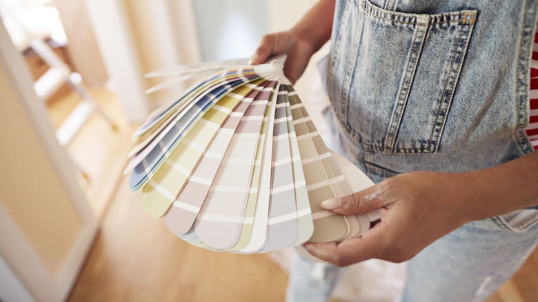 Someone looking at different paint colors