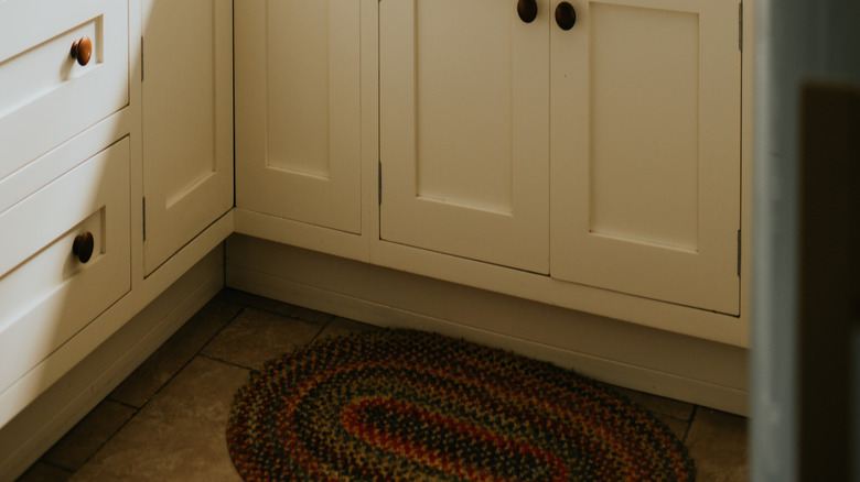 A close-up of a cozy small white kitchen