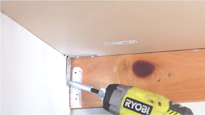 Ryobi drill attaching bracket to hold underside of laminate countertop