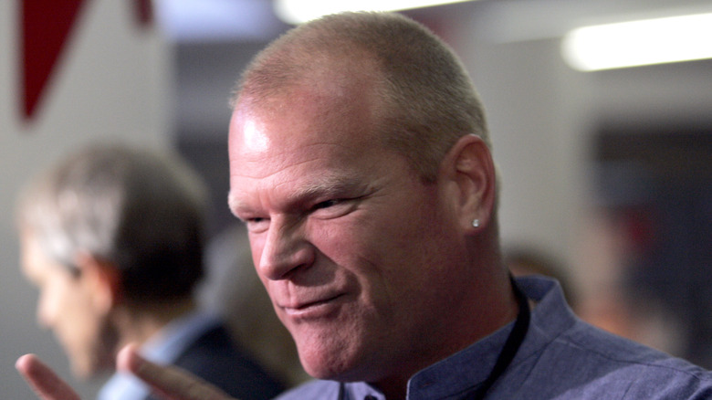 Mike Holmes wearing a blue shirt with a black lanyard