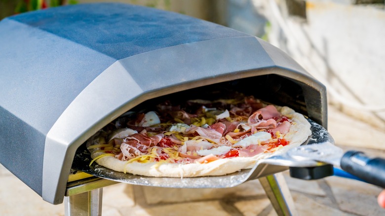 pizza being removed from oven