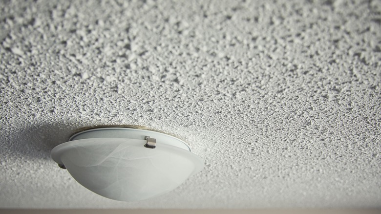 light fixture on popcorn ceiling