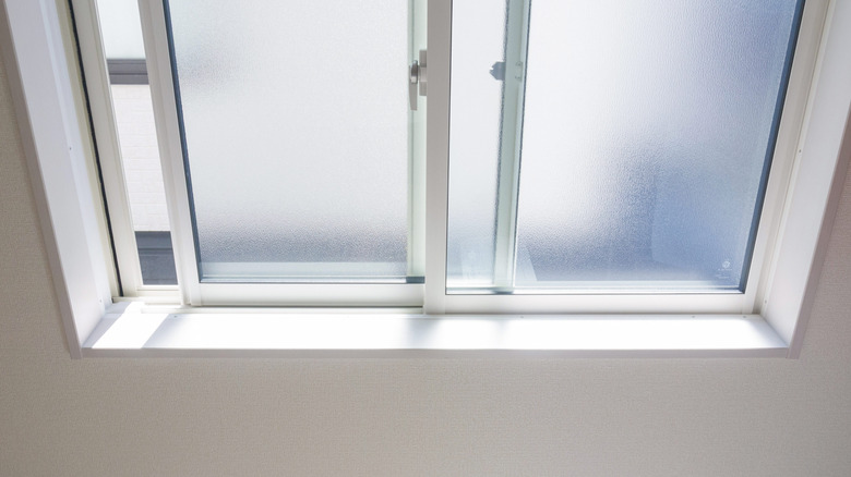 Window with frosted glass exposed to sunlight