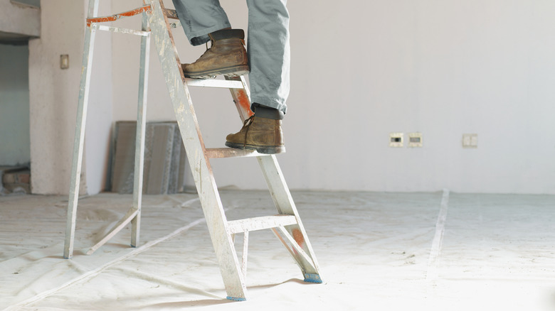 Person climbing a ladder
