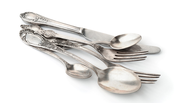 dirty tarnished silverware