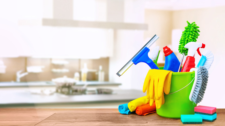 cleaning supplies in a bucket 