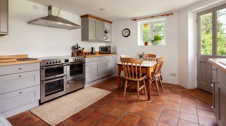 kitchen with terracotta floor tiles