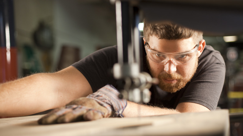 man using bandsaw jig wood