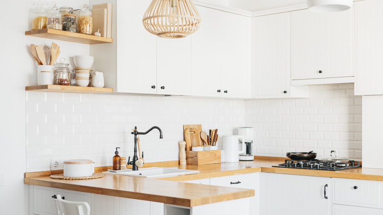 white kitchen with open shelving