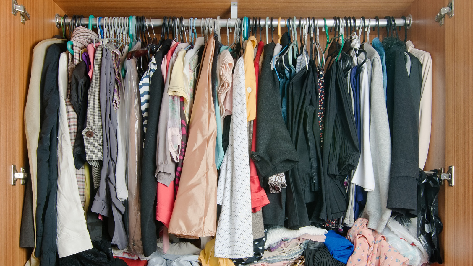 https://www.housedigest.com/img/gallery/the-best-way-to-hang-and-store-long-dresses-for-a-clutter-free-closet/l-intro-1695391452.jpg