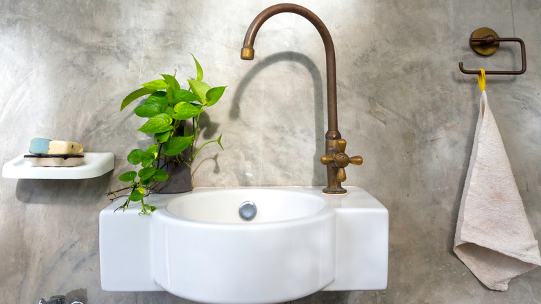 Brass faucet attached to sink