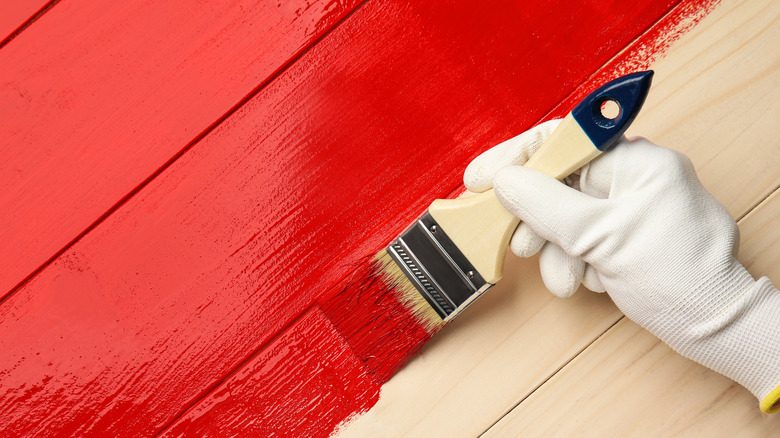 painting wood panel red