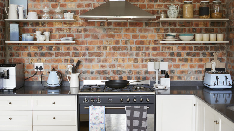 Brick wall backsplash in kitchen