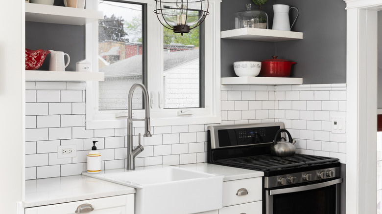 White subway tile backsplash with black grout in a kitchen