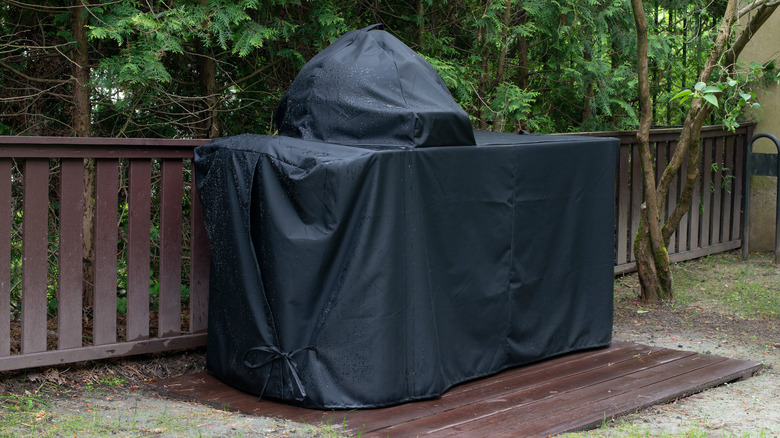 Covered grill in backyard