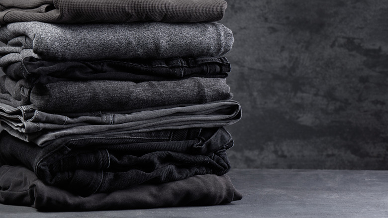 Dark jeans in a pile