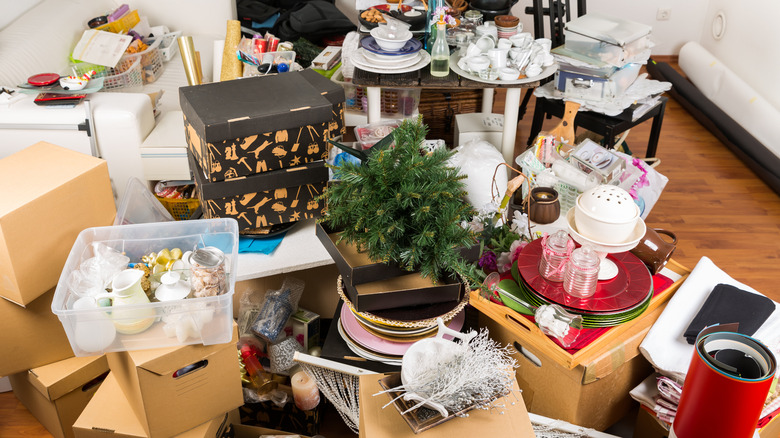 Room cluttered with boxes of decor and other home items