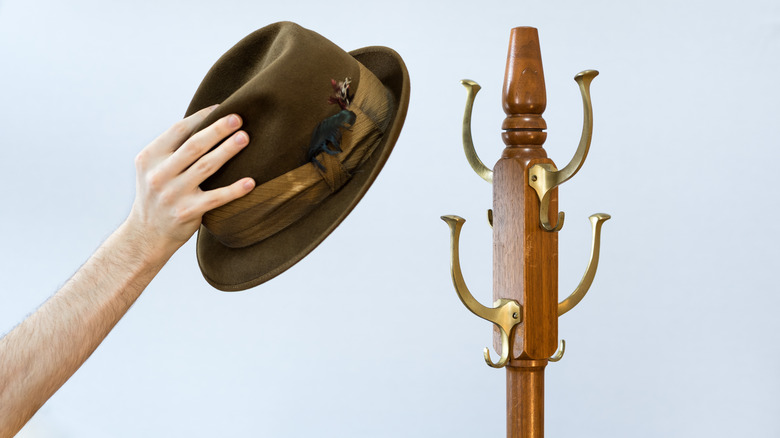 Putting fedora on hat rack