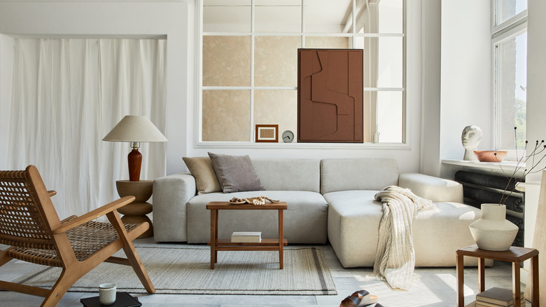 gray sofa with brown accent chair 