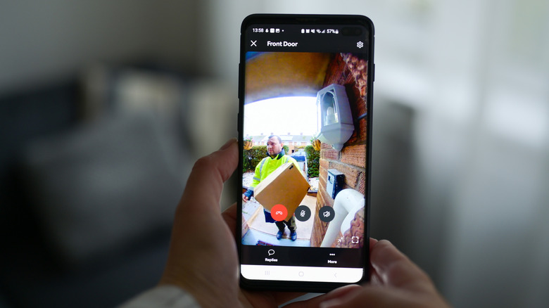 A person accessing their video camera feed from their smartphone