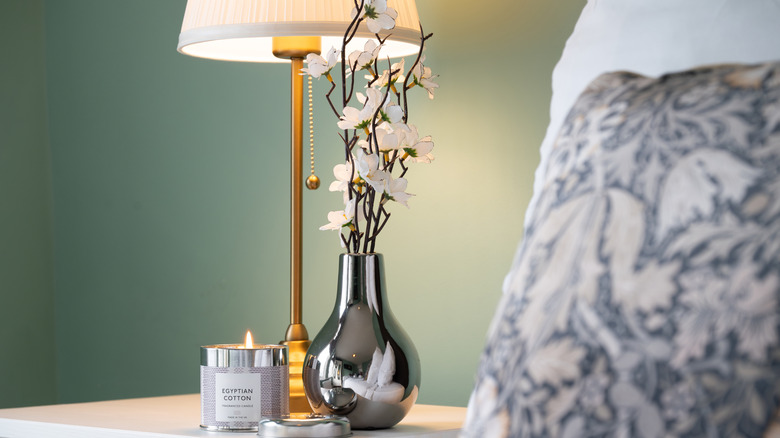 chrome vase on night stand