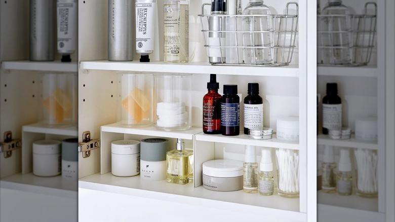 Neatly packed medicine cabinet using shelf risers to keep things organized