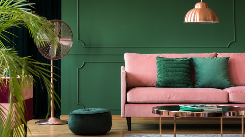 Pink sofa in green room