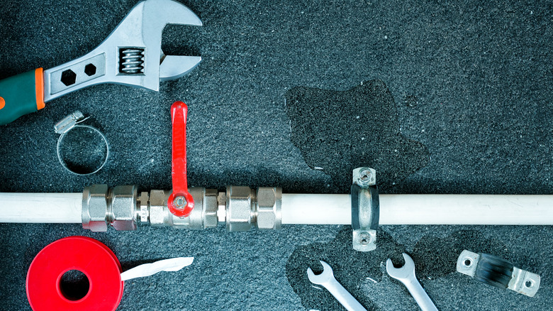 fixing leaking pipe concept