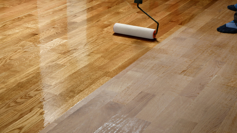 Someone lacquering wood floors