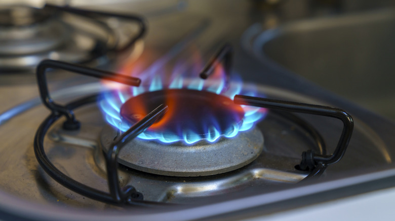 close-up of lit natural gas stove