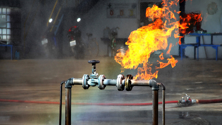 fire coming from pipe with gas leak