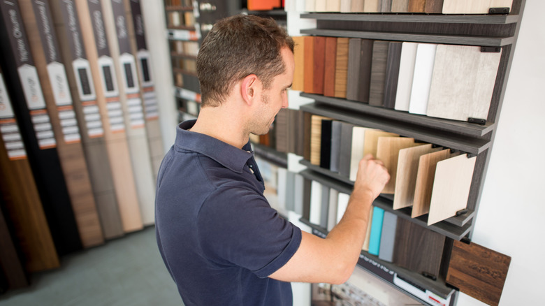 person picking out flooring