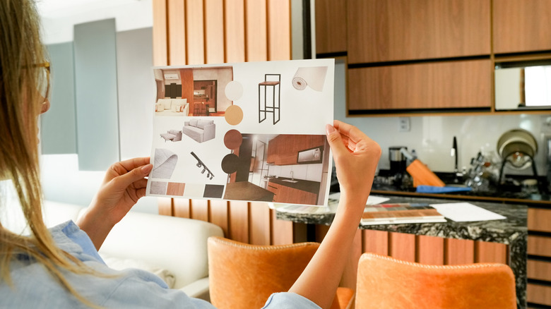 Woman using an interior design vision board