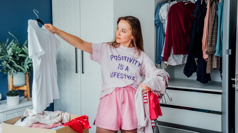 woman cleaning organizing closet