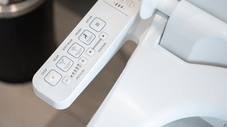 A close-up photo of a bidet seat control center