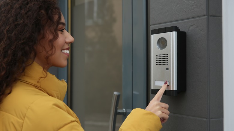 woman using doorbell camera