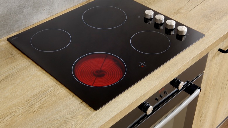 Glass cooktop with one burner lit