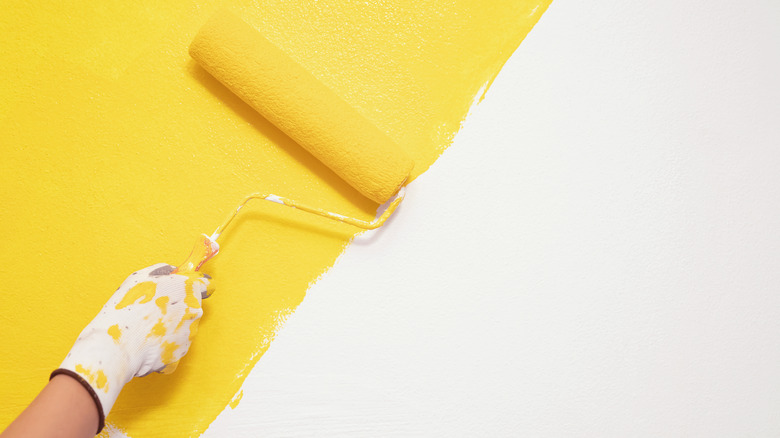 someone painting a wall
