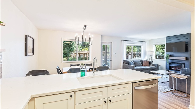 Kitchen area with white cabinets