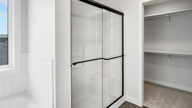 walk-in shower with black frame