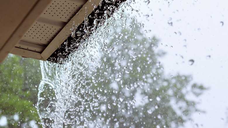 Rain pouring out of gutters